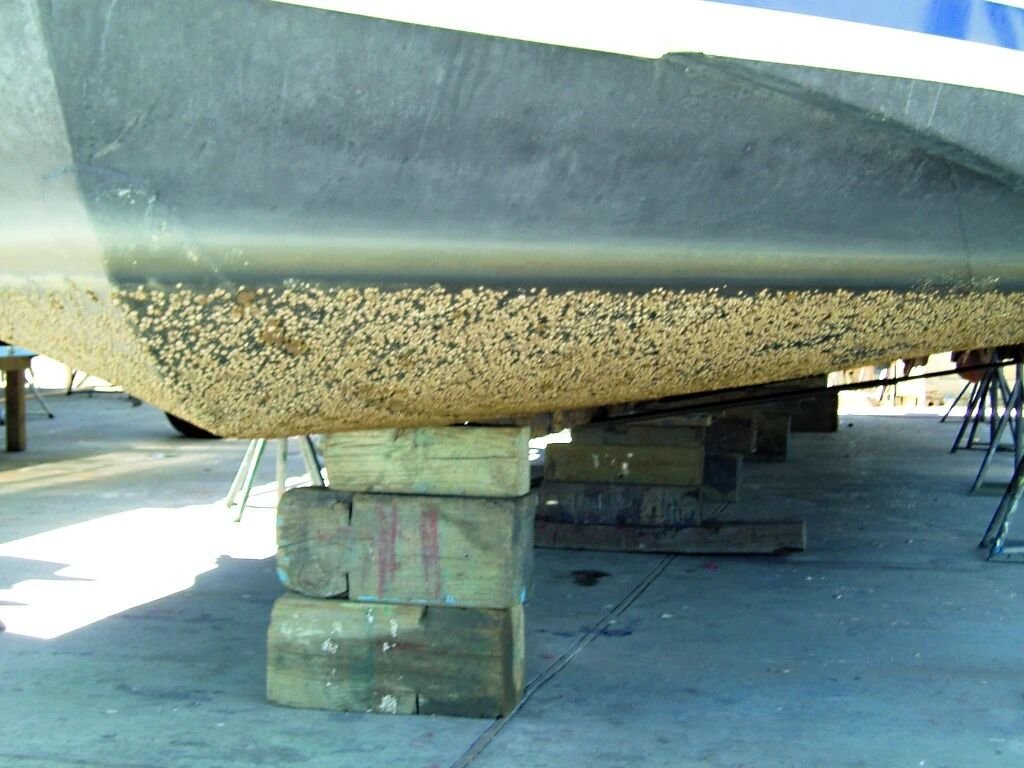 The boat's underside is severely corroded